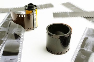 the roller 35 mm film on white background, black and white negatives