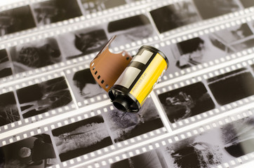 the roller 35 mm film on white background, black and white negatives