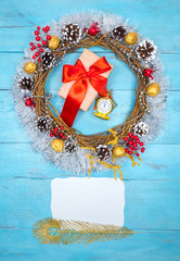 Christmas beautiful wreath on a wooden table, New Year decoration,