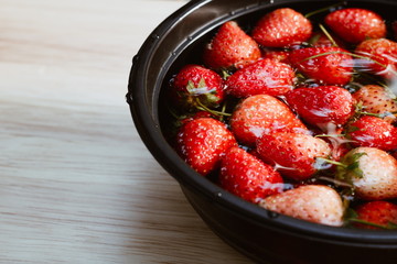 Fresh strawberry in bowl closeup