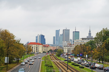 Fototapeta na wymiar Speedy road passes through Warsaw. View of Warsaw, view of the park and the skyscrapers of Warsaw.