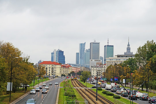 Speedy road passes through Warsaw. View of Warsaw, view of the park and the skyscrapers of Warsaw.