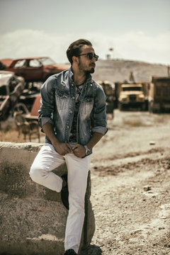Handsome guy in a junk yard 