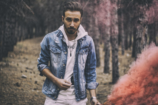 A young smokes up the forest