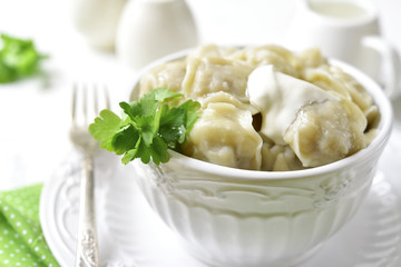Pelmeni (dumplings stuffed with minced meat)-  traditional dish of russian cuisine.