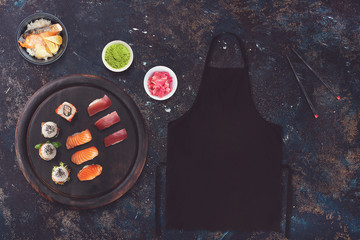 Blank black apron in a sushi restaurant