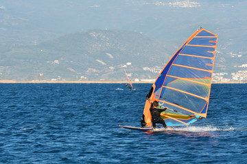 Naklejka premium Man Windsurfing Sea Beach Winter Sport