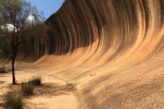 Wave Rock in Hyden, Western Australia. This rock formation looks like a tall breaking ocean wave.