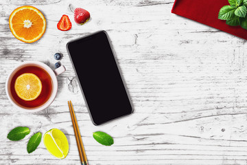 Black smartphone in a sushi bar