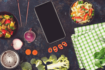 Black smartphone in a sushi bar