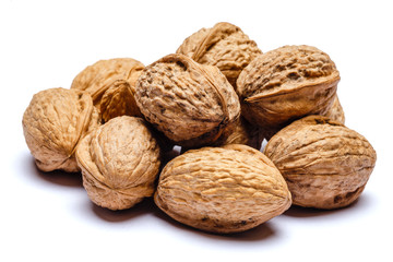 pile of walnuts isolated on white background