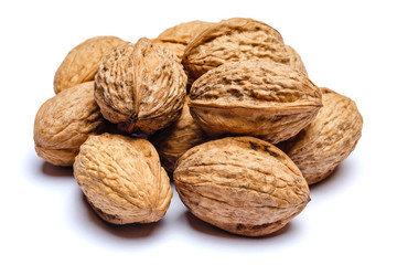 pile of walnuts isolated on white background