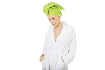 Spa woman in bathrobe and turban.