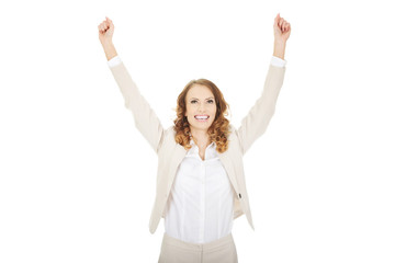 Successful businesswoman making fists.