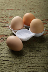Fresh raw bio eggs on wood