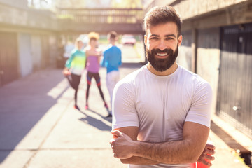 Handsome fitness guy with toothy smile.