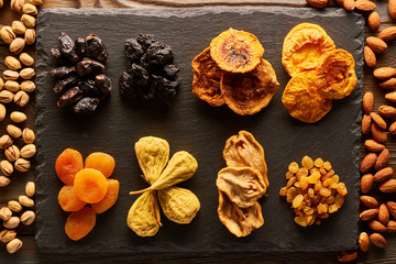 Dried fruits and nuts on slate plate