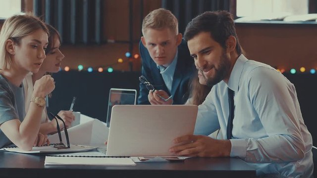 Smiling people at work in the loft