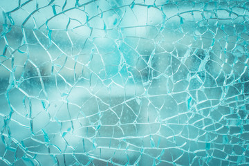 Broken glass and blurred city background