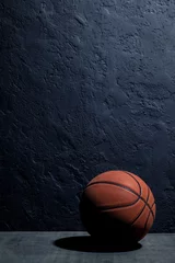 Fotobehang basketball on a black background © BortN66