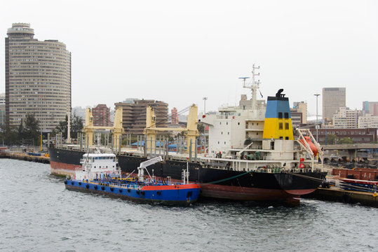 Bunker Barge Moored To Big Ship