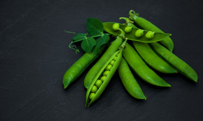 green peas on a stone background