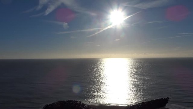 Folkestone beach in the morning with sun reflection