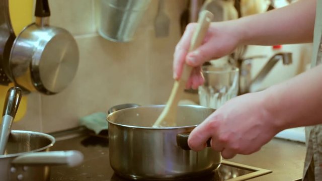 Stirring food in pan during cooking