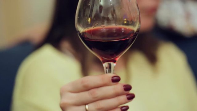 Young woman holding a wine glass