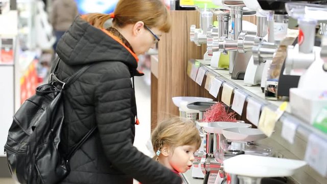 Mother with daughter in store