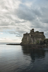 Castle of Aci Catello with cloudy sky - Sicily