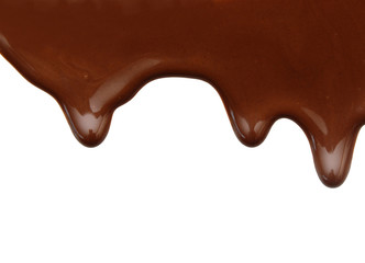 Close up of chocolate syrup leaking on white background