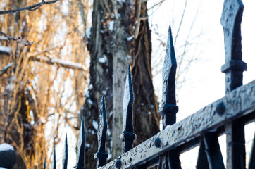 Old cast iron spiked fence in a park