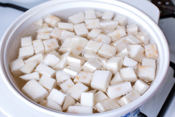Cubes of celery root in boiling water