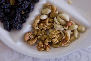 Walnuts, black cheese, white raisins, nuts