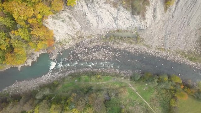 Top down aerial view of moving river Prut in Carpathian Mountains near by Yaremche, ukraine