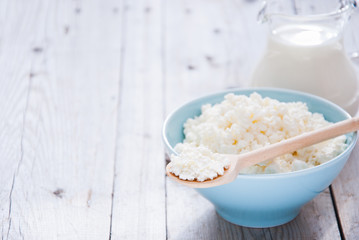 Organic Farming Cottage cheese in a blue bowl and milk