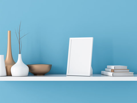 White Photo frame Mockup on shelf with books and decor. Blue wall background, 3d rendering