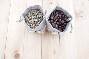 Bag of coffee beans and a cup of coffee on the table.