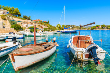 Fishing boats anchoring in beautiful bay with turquoise sea water in Razanj port, Dalmatia, Croatia