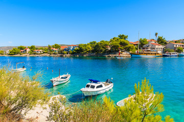 Fototapeta na wymiar Boats anchoring in beautiful bay with turquoise sea water in Razanj port, Dalmatia, Croatia