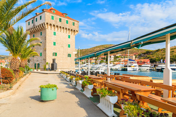 Fototapeta premium Restaurant on shore in Marina Agana port, Dalmatia, Croatia