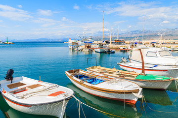 Fototapeta na wymiar Colorful fishing boats in Postira port on Brac island, Croatia