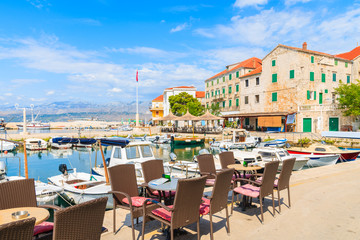 Restaurant tables in Postira port on Brac island, Croatia