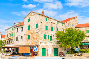 POSTIRA PORT, BRAC ISLAND - SEP 7, 2017: Old stone houses in Postira village with beautiful port, Brac island, Croatia.