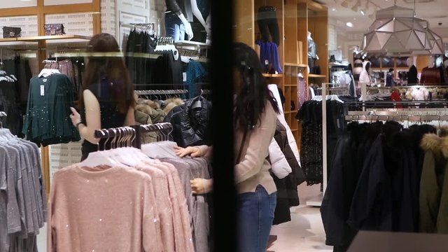 Attractive young woman shopping for clothes