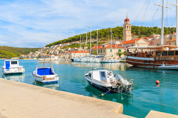 Fishing boat and wooden yacht in Pucisca port, Brac island, Croatia