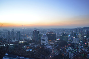 Fototapeta premium Cityscape at N Seoul Tower during the sunset. Panorama from the top of Seoul, South Korea