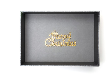 Merry christmas text in black gift box