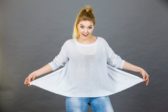 Woman wearing too big jumper